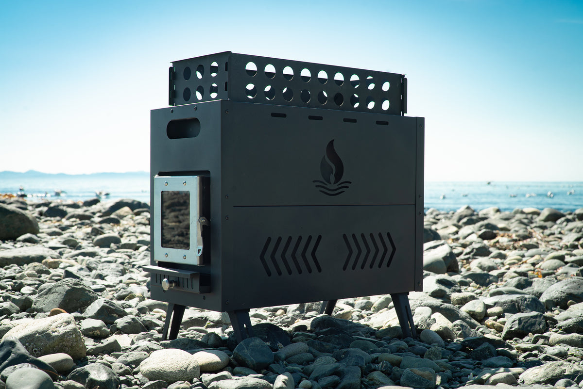 Igni sauna stove with rock basket on a rocky beach